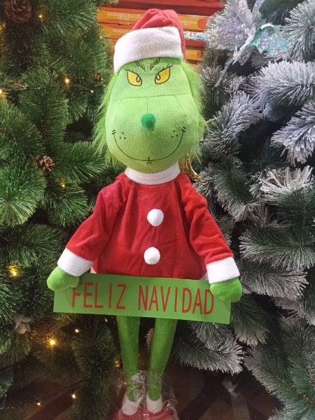 Grinch patilarga con letrero Feliz Navidad